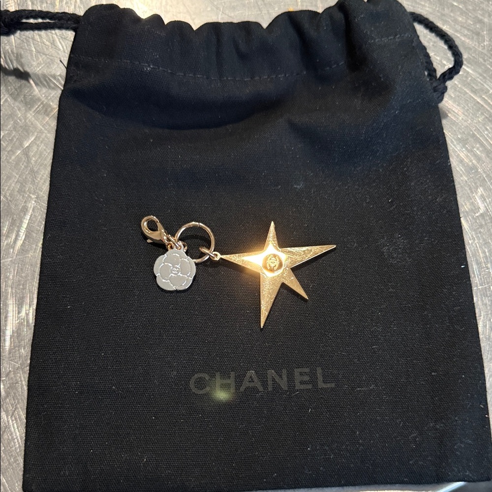 CHANEL Gold Star and silver flower holiday 2025 Charm with Black Pouch